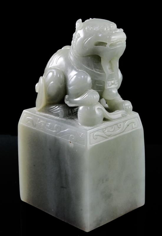 A large Chinese celadon jade lion-dog seal, height 15.5cm